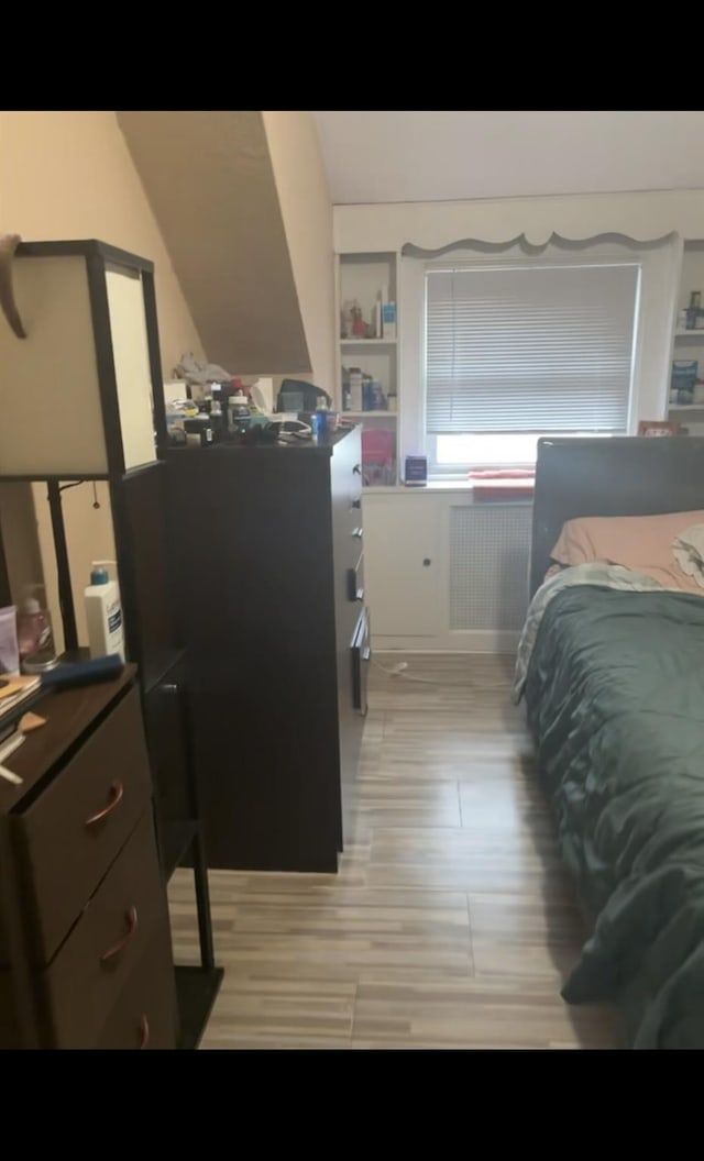 bedroom featuring radiator heating unit