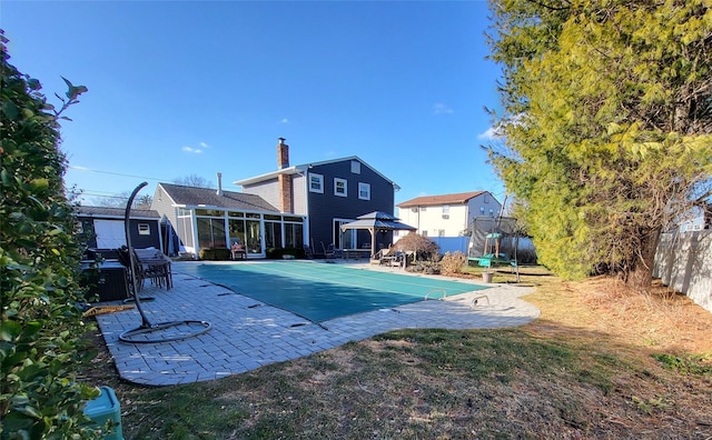 rear view of house with a gazebo and a patio