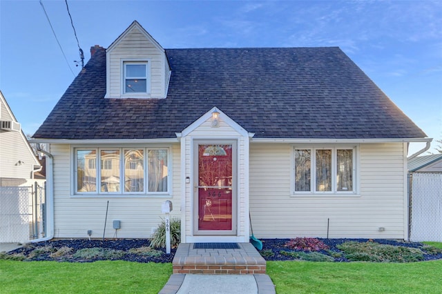 bungalow-style home featuring a front yard