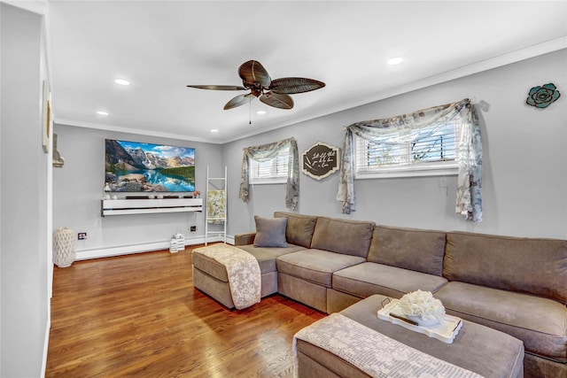 living room featuring ceiling fan, crown molding, a baseboard radiator, and hardwood / wood-style floors