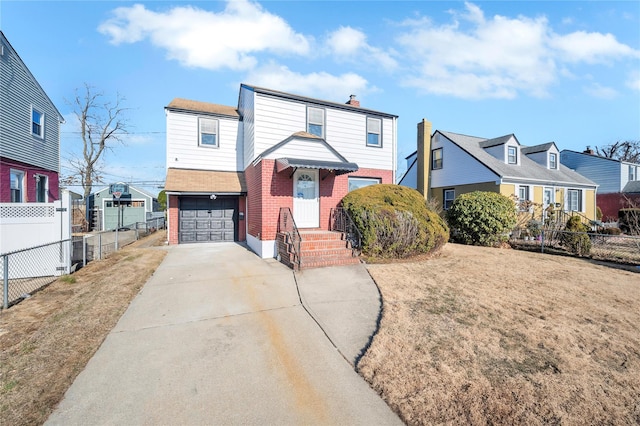 view of front facade with a front yard and a garage