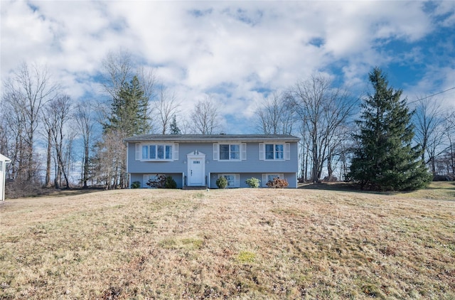 split foyer home featuring a front lawn