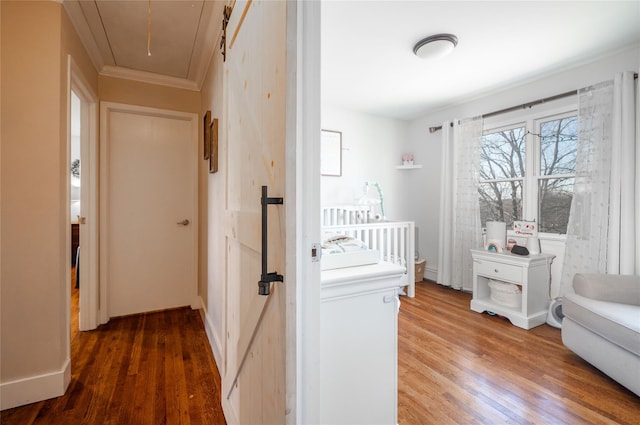 bedroom with dark wood-type flooring and crown molding