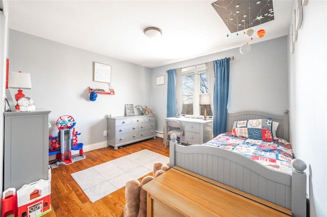 bedroom with wood-type flooring