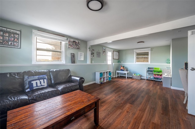 living room featuring dark wood-type flooring