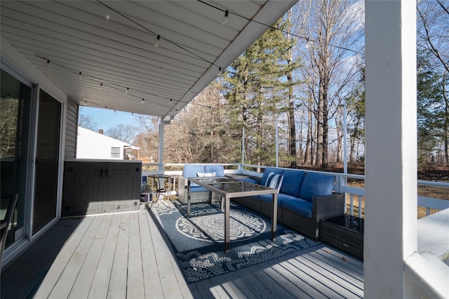 wooden terrace featuring an outdoor hangout area