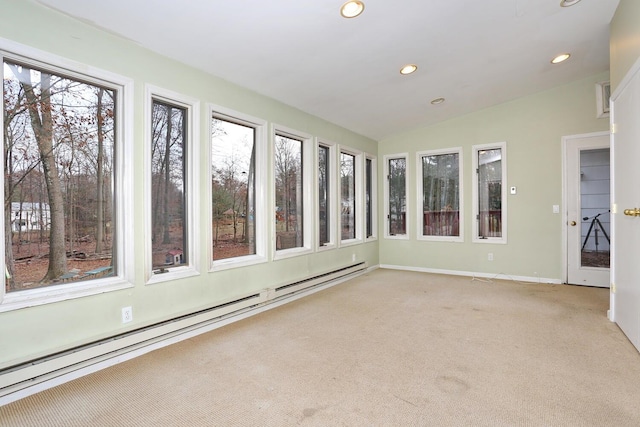 unfurnished sunroom with lofted ceiling and a baseboard heating unit