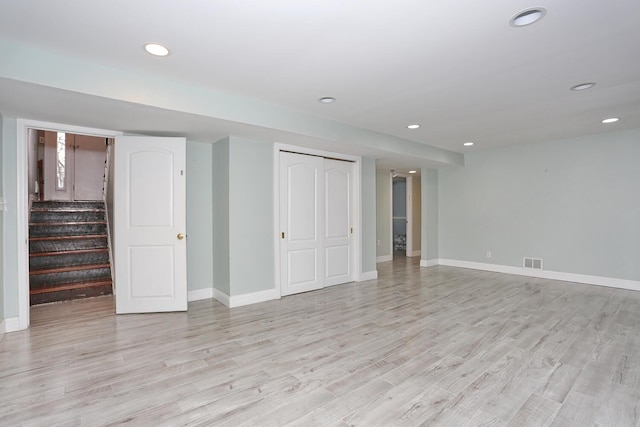 basement featuring light hardwood / wood-style flooring