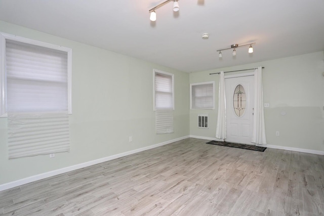 foyer entrance featuring light hardwood / wood-style flooring