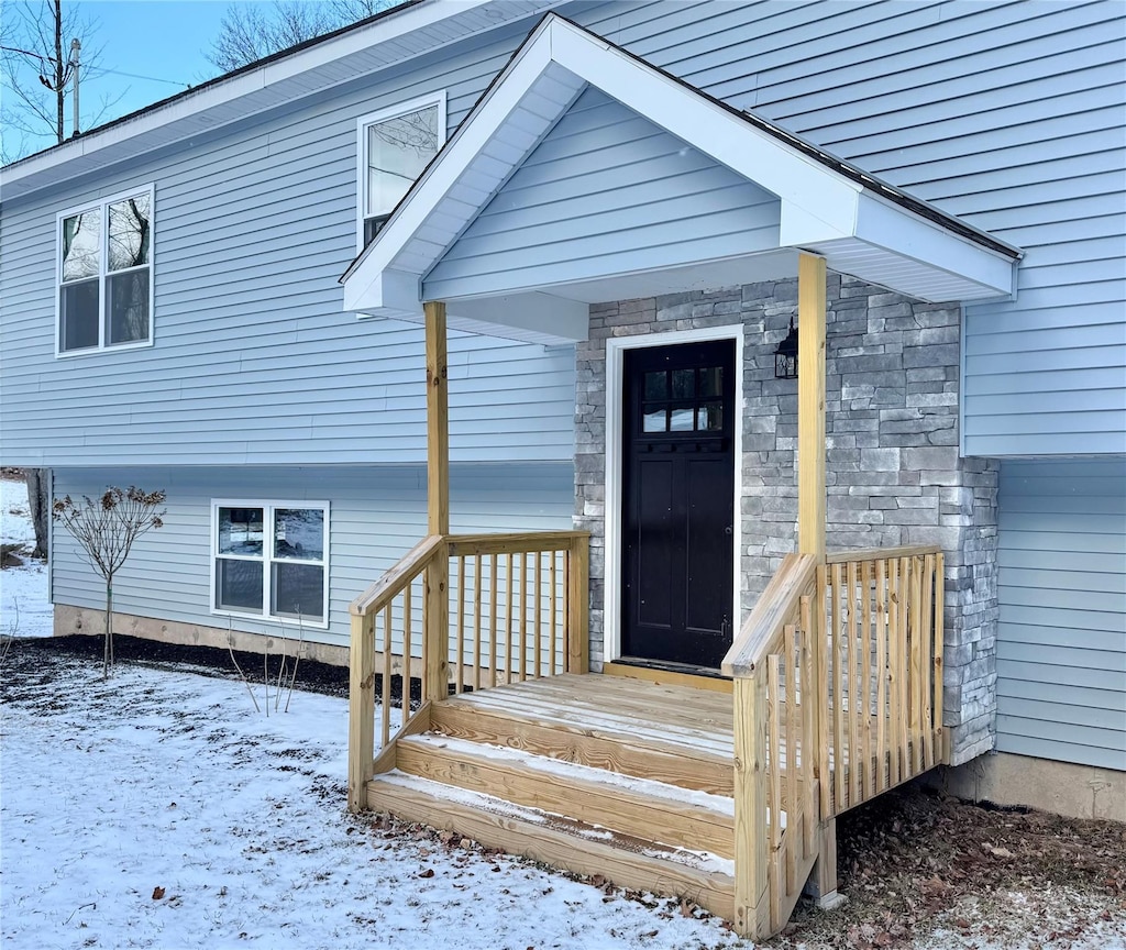 view of snow covered property entrance