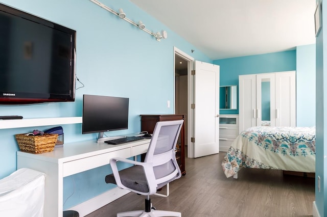 bedroom featuring dark hardwood / wood-style floors