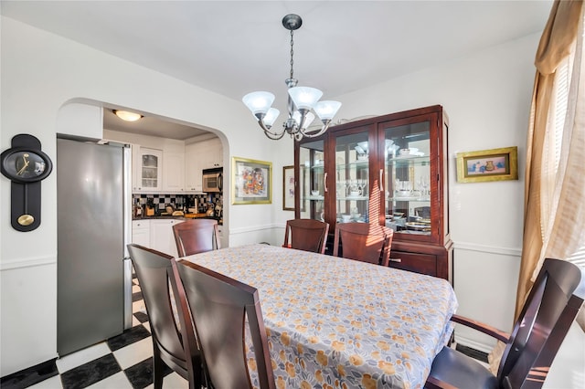 dining space with a chandelier