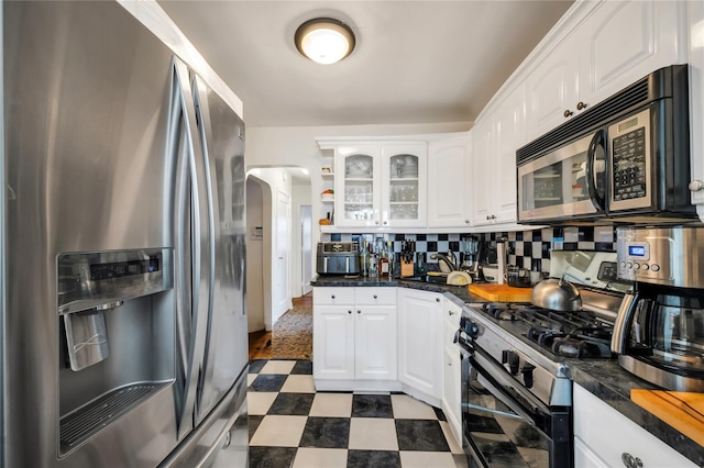 kitchen with white cabinetry and appliances with stainless steel finishes