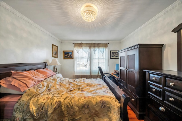 bedroom featuring an inviting chandelier, ornamental molding, and dark hardwood / wood-style floors