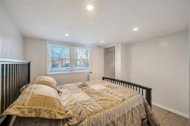 bedroom featuring light tile patterned floors