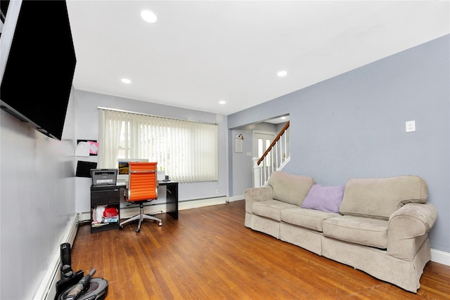 office with baseboard heating and wood-type flooring