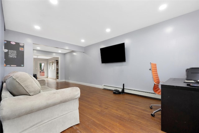 living room with wood-type flooring and a baseboard radiator