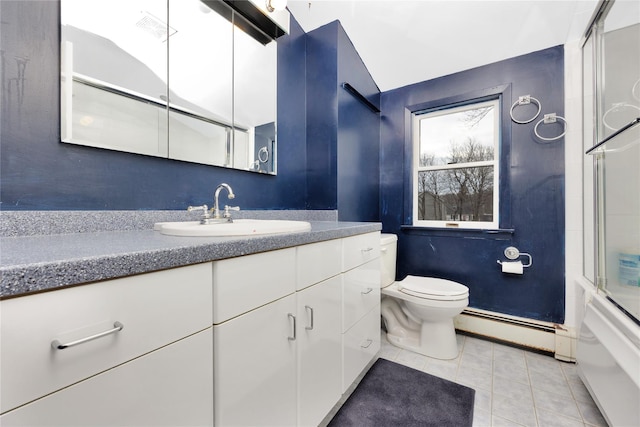 full bathroom featuring toilet, tile patterned flooring, combined bath / shower with glass door, a baseboard heating unit, and vanity