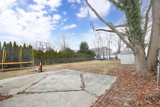 view of sport court with a trampoline