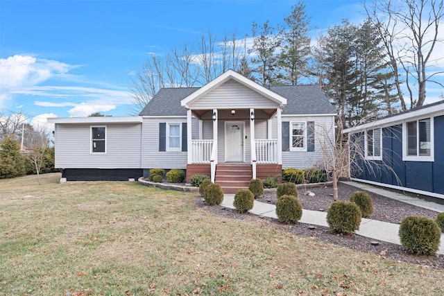 view of front of home with covered porch and a front yard