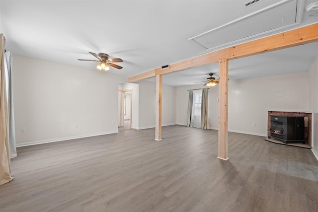 basement with hardwood / wood-style floors and ceiling fan