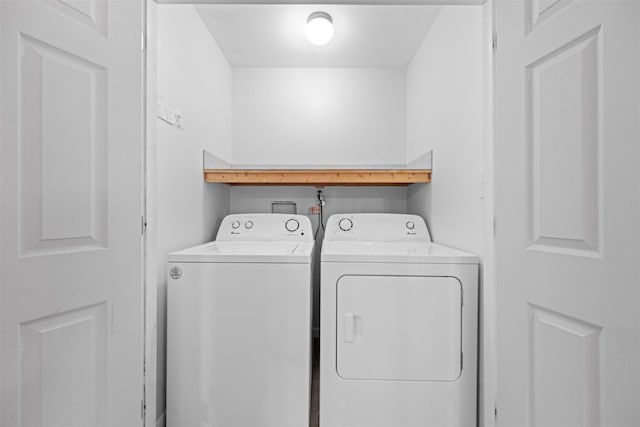 washroom featuring washer and clothes dryer