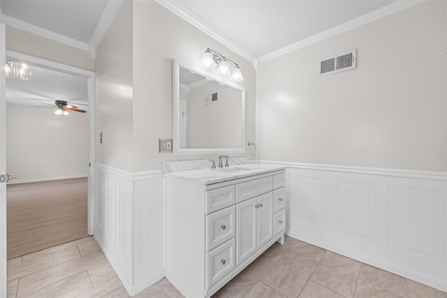 bathroom featuring vanity, tile patterned floors, ornamental molding, and ceiling fan