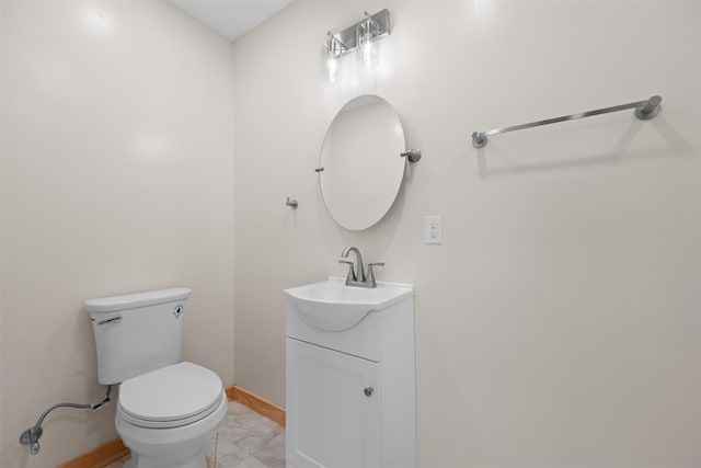 bathroom with toilet and vanity