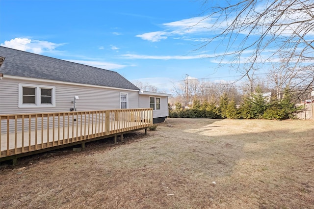 exterior space with a lawn and a wooden deck