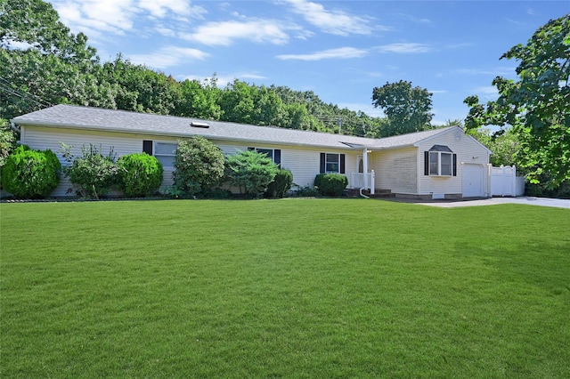 single story home with a front yard and a garage