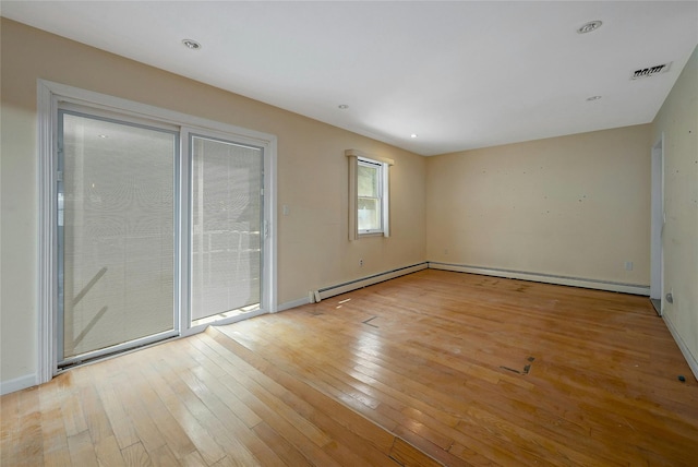 unfurnished room with light hardwood / wood-style flooring