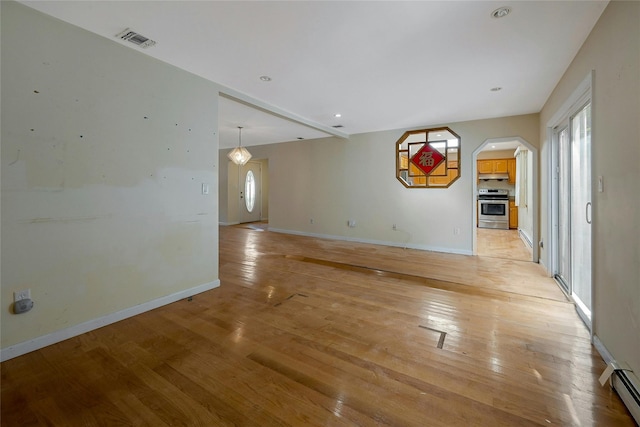 unfurnished living room featuring light hardwood / wood-style floors