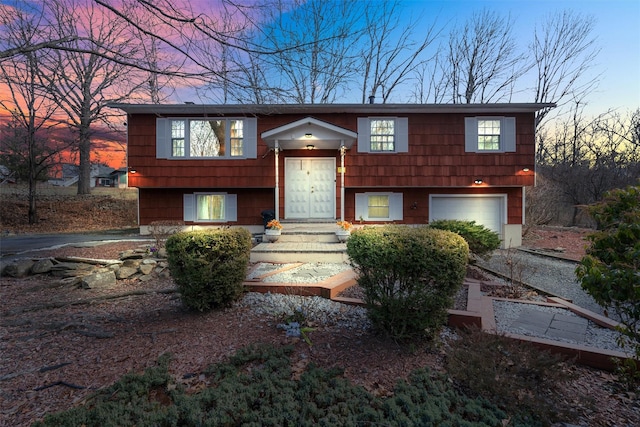 bi-level home featuring a garage