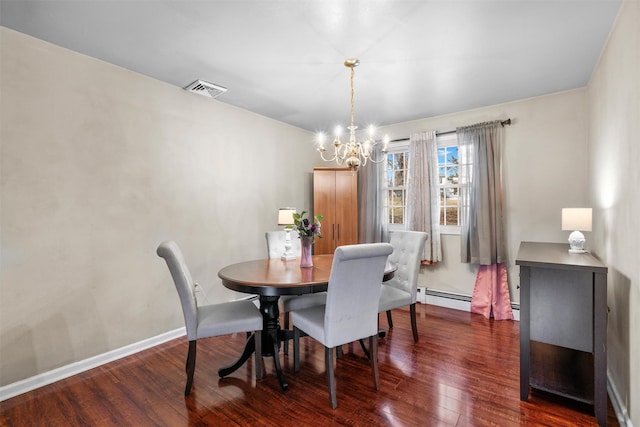 dining area featuring a baseboard heating unit, a chandelier, and dark hardwood / wood-style floors