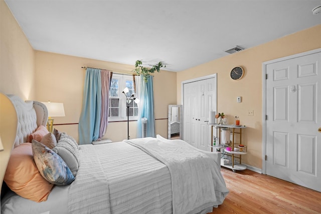 bedroom with light hardwood / wood-style flooring