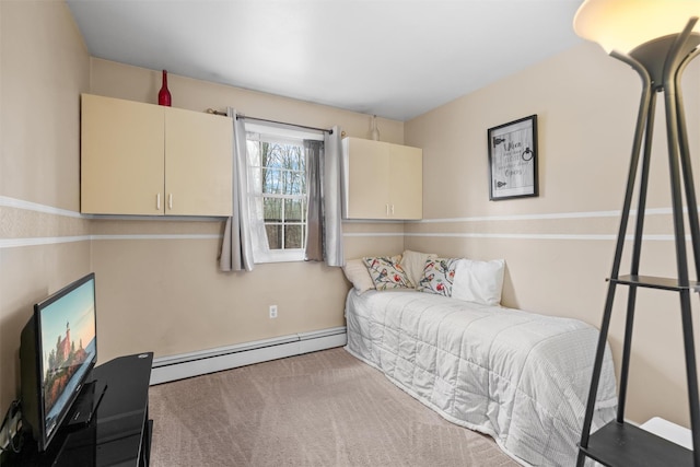 carpeted bedroom featuring baseboard heating