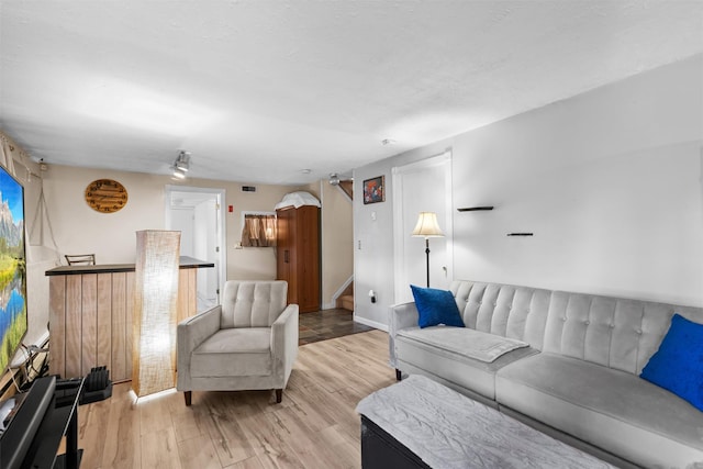 living room with light hardwood / wood-style floors