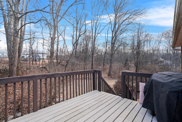 wooden terrace featuring grilling area