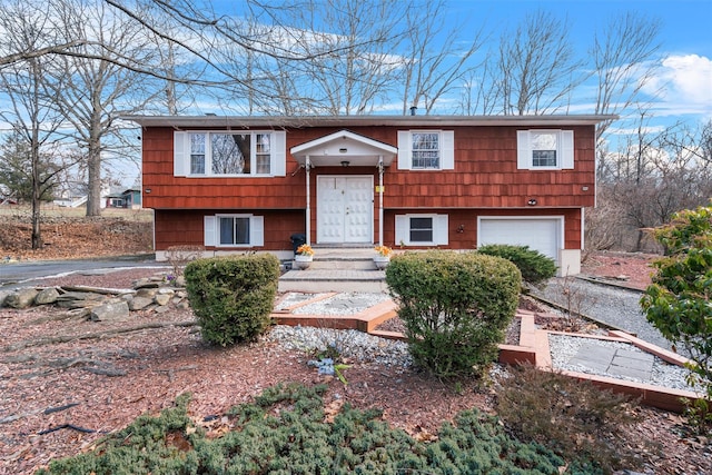 split foyer home featuring a garage