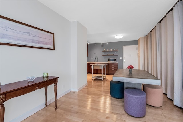 dining room with light hardwood / wood-style flooring