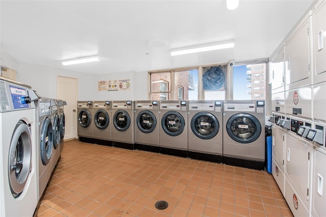 laundry area with stacked washer / drying machine and washer and dryer