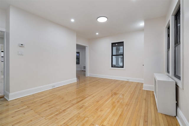 unfurnished room with light hardwood / wood-style floors