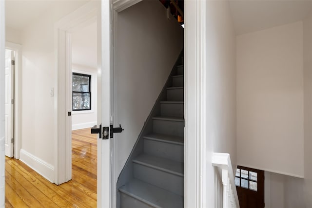 staircase featuring hardwood / wood-style flooring