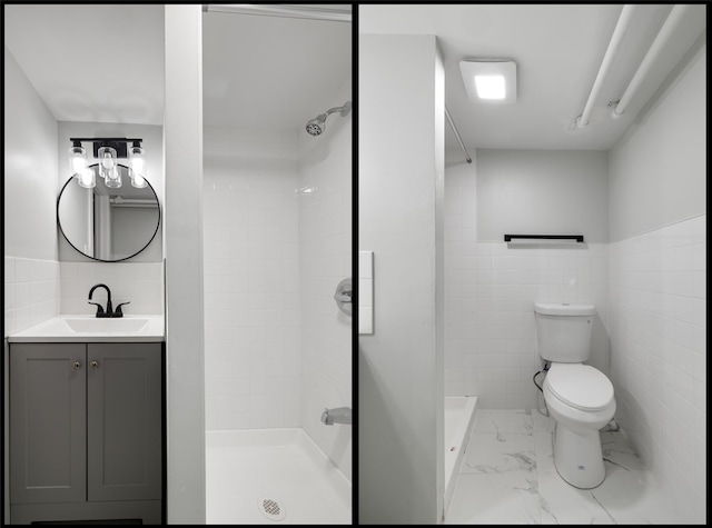 bathroom featuring toilet, vanity, tile walls, and a shower