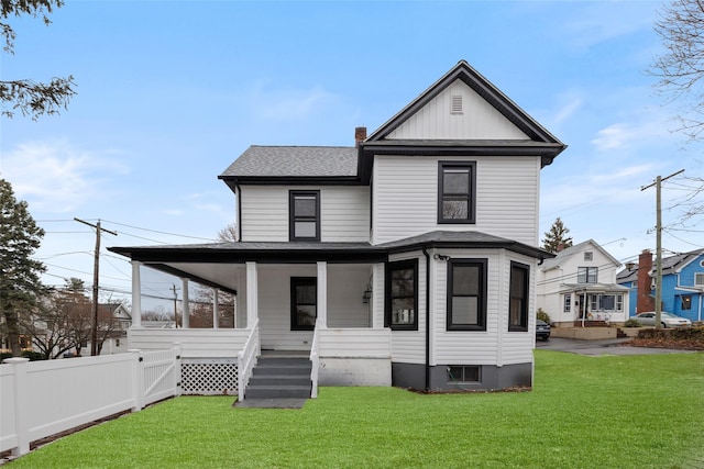 view of front facade featuring a front yard and a porch