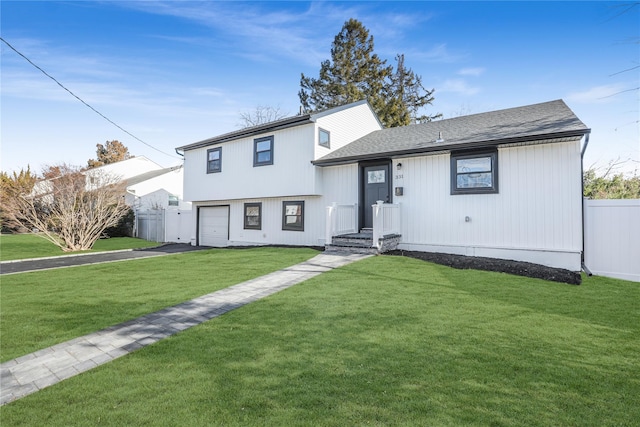 view of front facade featuring a front lawn and a garage