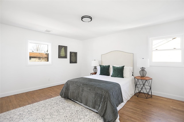 bedroom with light hardwood / wood-style floors