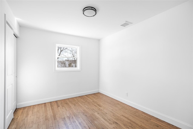 unfurnished room featuring light hardwood / wood-style floors