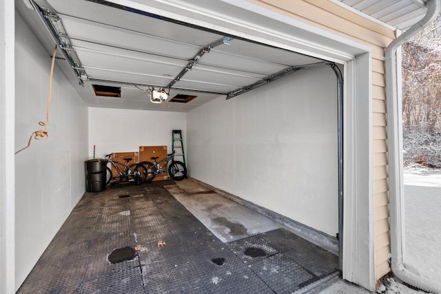 garage featuring a garage door opener