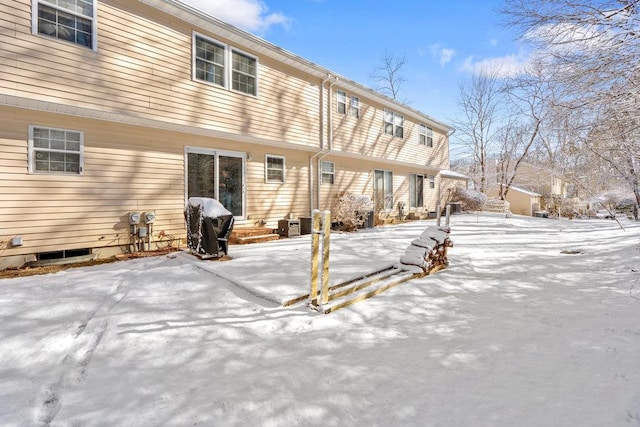 view of snow covered house